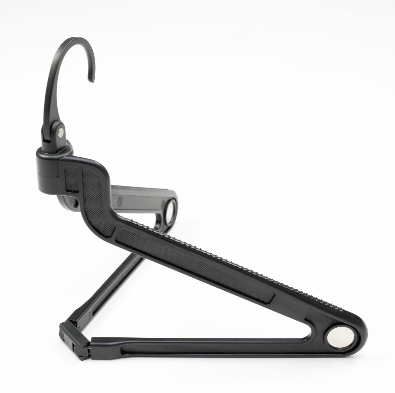 The PLIQO folding Hanger viewed from the side over a white background.